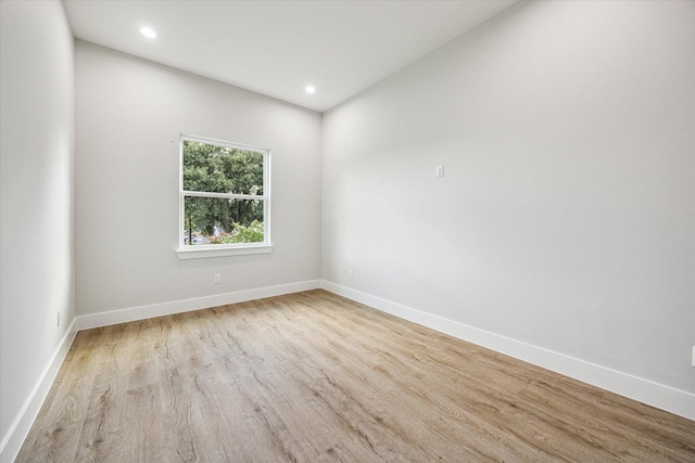 unfurnished room with light hardwood / wood-style flooring