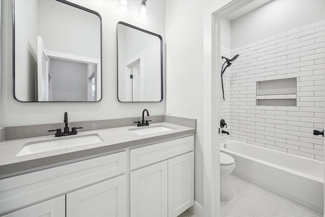 full bathroom with tile patterned floors, vanity, toilet, and tiled shower / bath combo