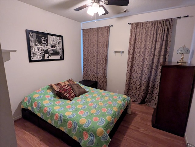 bedroom featuring hardwood / wood-style flooring and ceiling fan