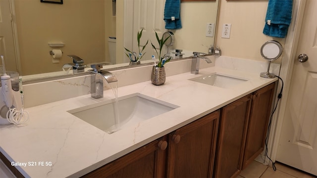 bathroom featuring vanity and tile patterned flooring