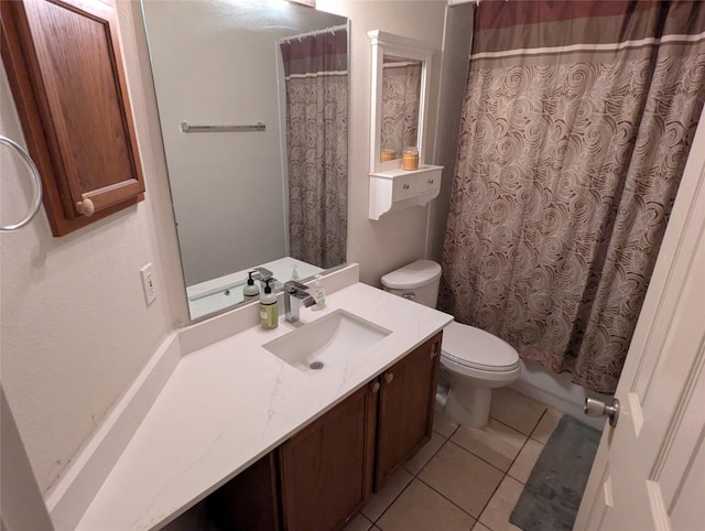 bathroom featuring vanity, toilet, and tile patterned flooring