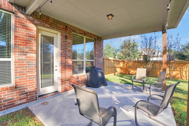 view of patio with a grill