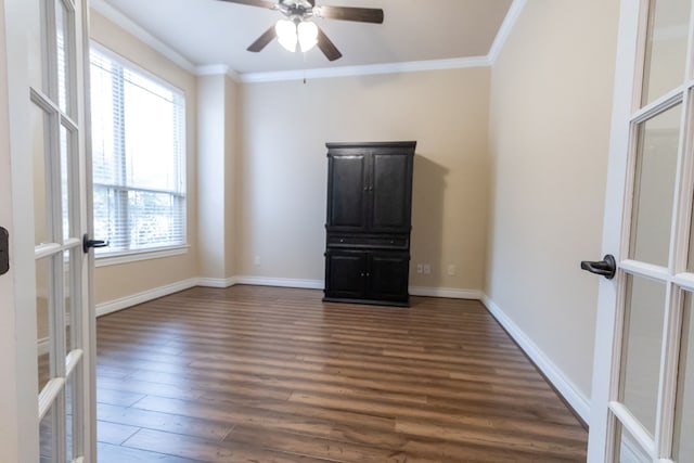 unfurnished room featuring french doors, ceiling fan, ornamental molding, and dark hardwood / wood-style floors