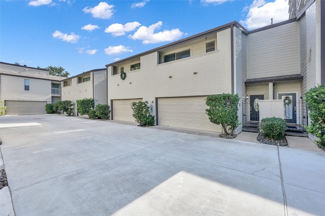 multi unit property featuring a garage