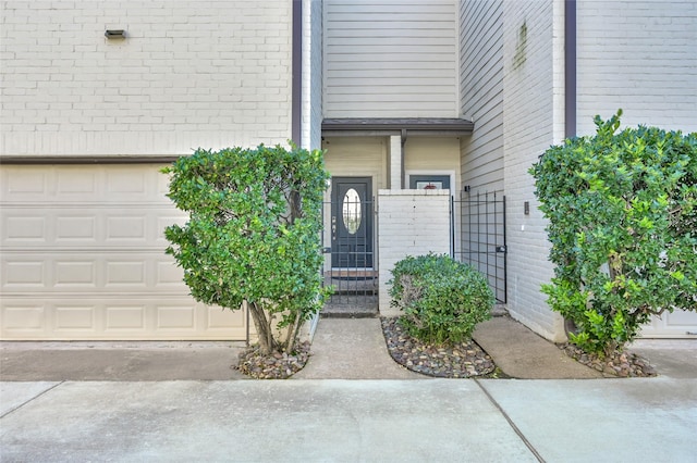 view of exterior entry with a garage