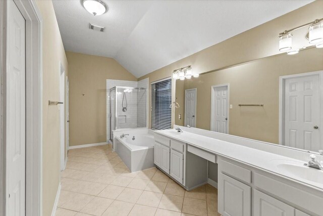 full bathroom with a stall shower, visible vents, a bath, tile patterned floors, and a sink