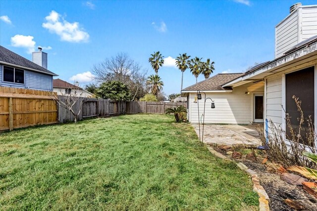 view of yard with a fenced backyard and a patio