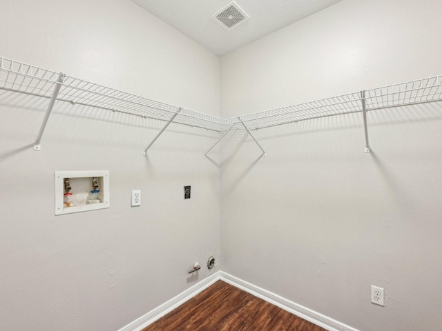 laundry room with gas dryer hookup, hardwood / wood-style floors, hookup for a washing machine, and electric dryer hookup