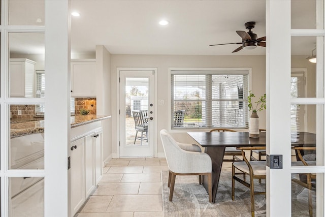 dining area with light tile patterned floors and ceiling fan