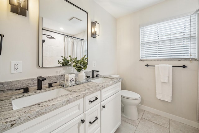 bathroom with tile patterned flooring, vanity, a shower with curtain, and toilet