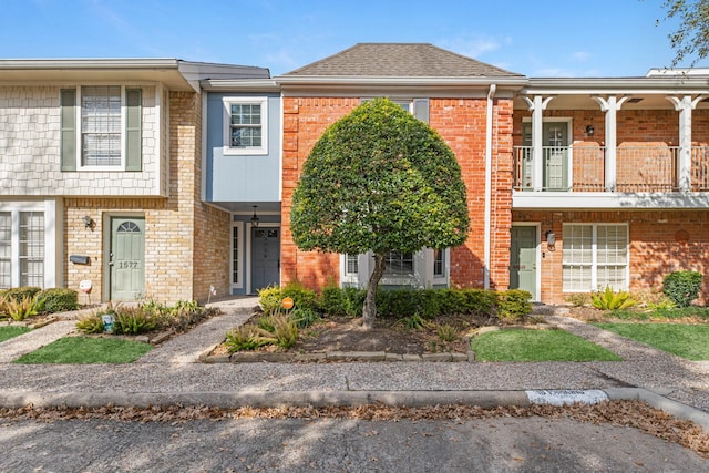 townhome / multi-family property featuring a balcony