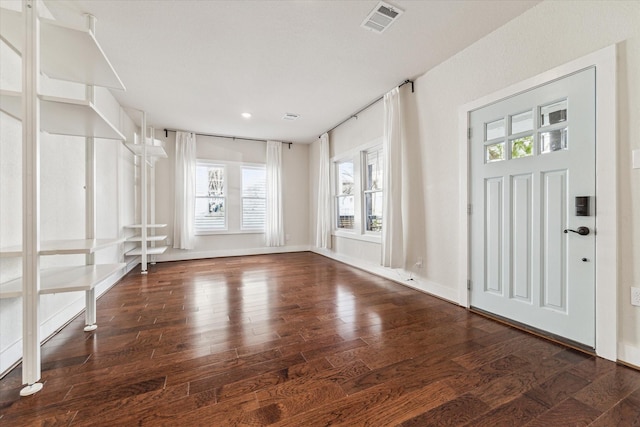 entrance foyer featuring dark hardwood / wood-style floors