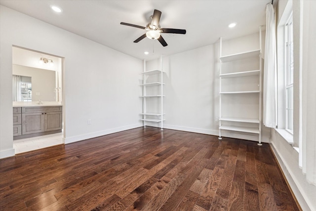 interior space with hardwood / wood-style flooring, sink, and ceiling fan