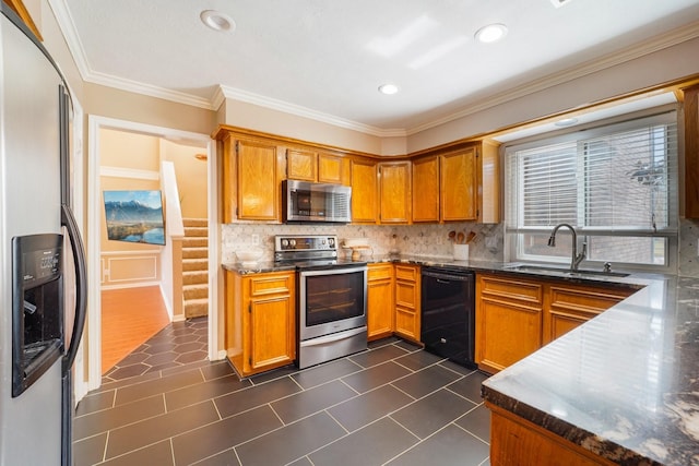 kitchen featuring sink, backsplash, dark tile patterned floors, stainless steel appliances, and crown molding