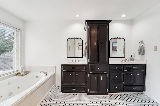 bathroom featuring vanity and a tub