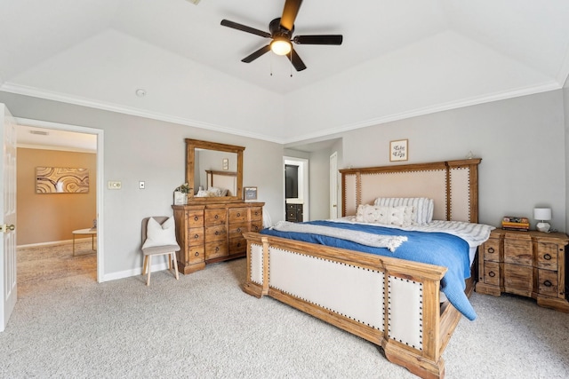 carpeted bedroom featuring crown molding, ceiling fan, lofted ceiling, and a tray ceiling