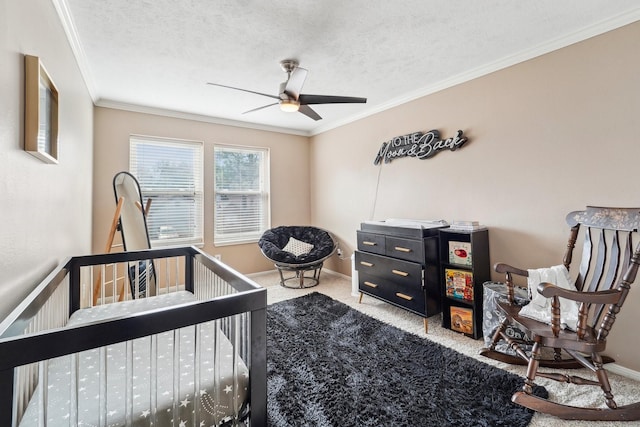 carpeted bedroom with ceiling fan, crown molding, and a textured ceiling