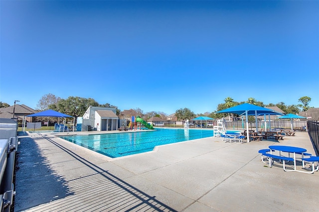 view of swimming pool with a patio area