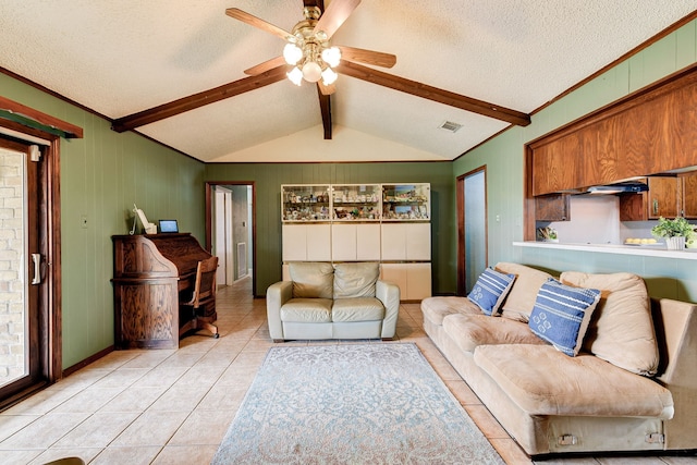 living room with vaulted ceiling with beams, light tile patterned floors, a textured ceiling, and ceiling fan