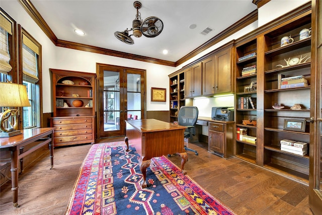 office area with french doors, dark hardwood / wood-style floors, built in desk, and crown molding