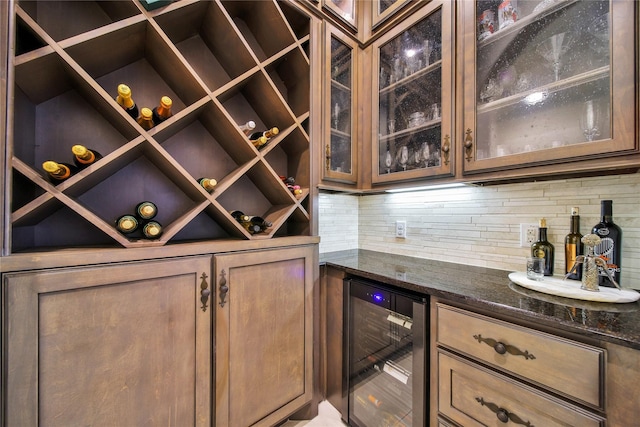 wine cellar with wine cooler and bar area