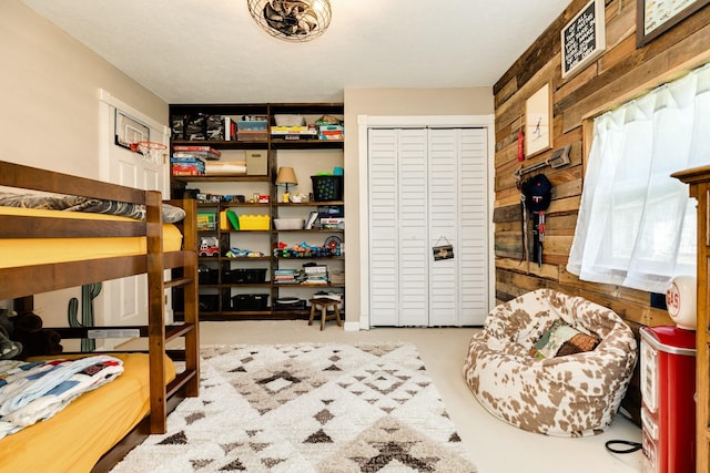 bedroom with wooden walls