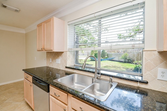 kitchen featuring light brown cabinetry, sink, crown molding, light tile patterned floors, and dishwasher