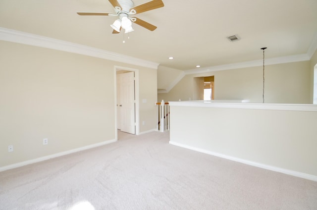 carpeted empty room with ornamental molding and ceiling fan