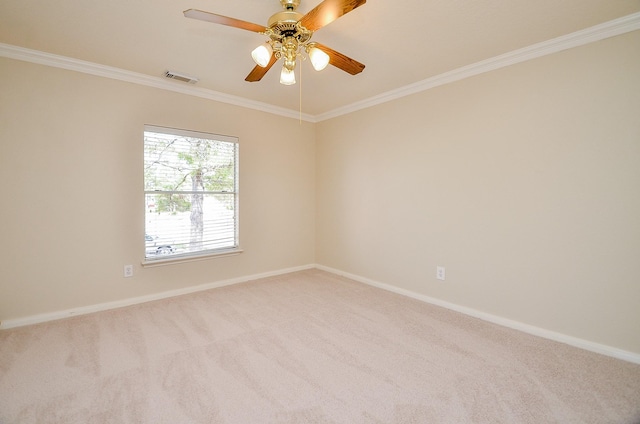 carpeted empty room featuring crown molding and ceiling fan