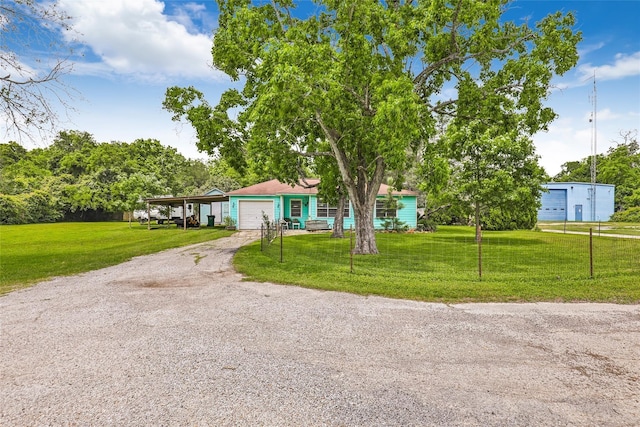 view of front facade with a garage and a front yard