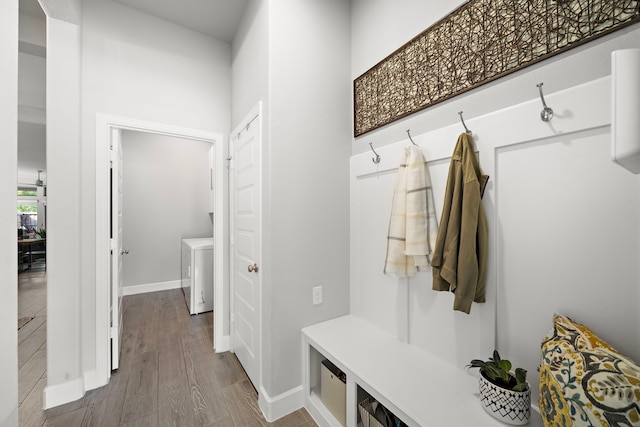 mudroom with washer / dryer and hardwood / wood-style floors