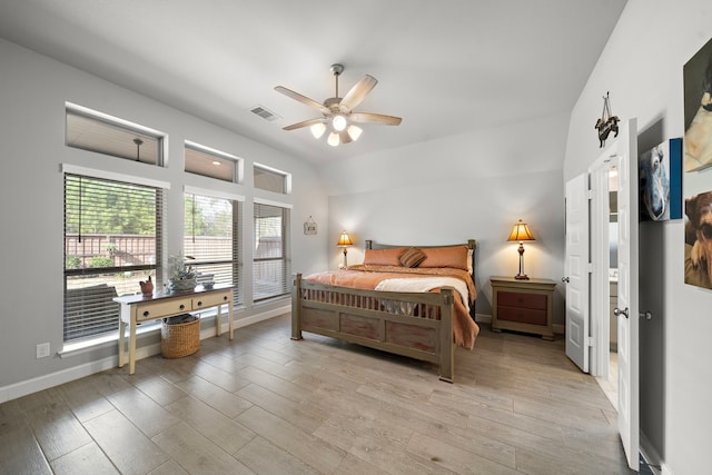 bedroom with ceiling fan and light hardwood / wood-style floors