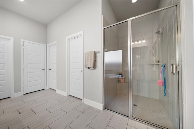 bathroom with a shower with shower door