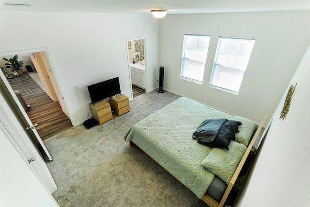 bedroom with light colored carpet