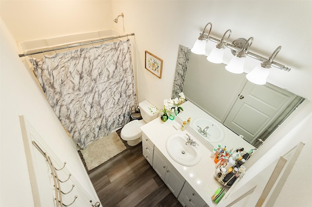 bathroom with vanity, hardwood / wood-style floors, toilet, and walk in shower