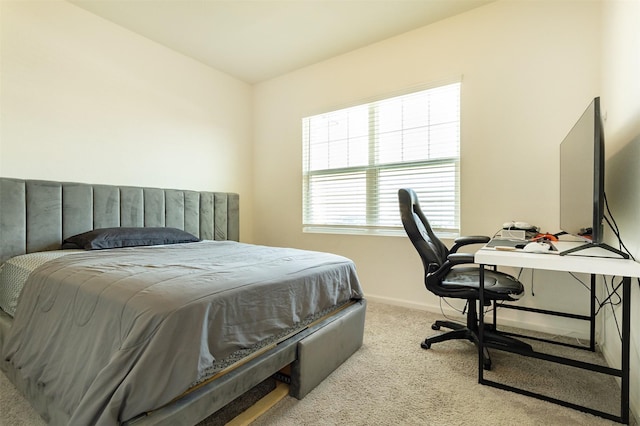 bedroom featuring light colored carpet