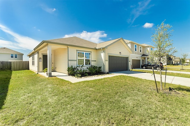 view of front of property featuring a garage and a front lawn