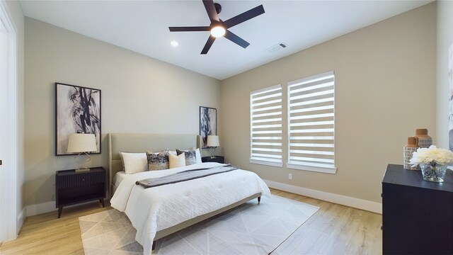 bedroom with ceiling fan and light wood-type flooring