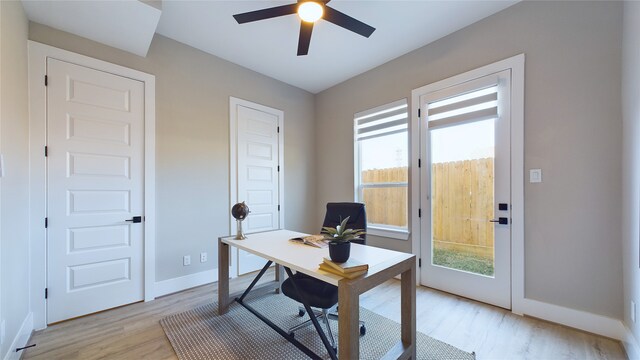 home office with ceiling fan and light wood-type flooring