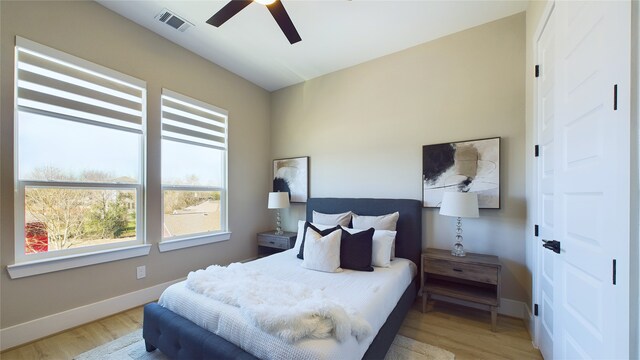 bedroom featuring wood-type flooring and ceiling fan