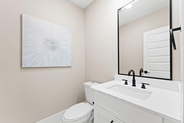 4013 Griggs Rd Unit L, Houston, TX 77021 - half bathroom with toilet, baseboards, and vanity