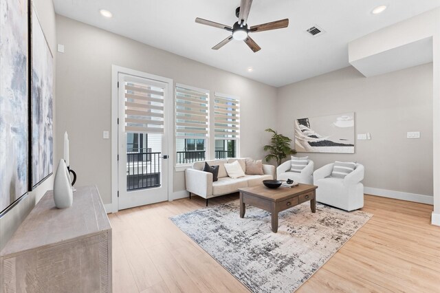 4013 Griggs Rd Unit L, Houston, TX 77021 - living room featuring visible vents, baseboards, ceiling fan, and wood finished floors