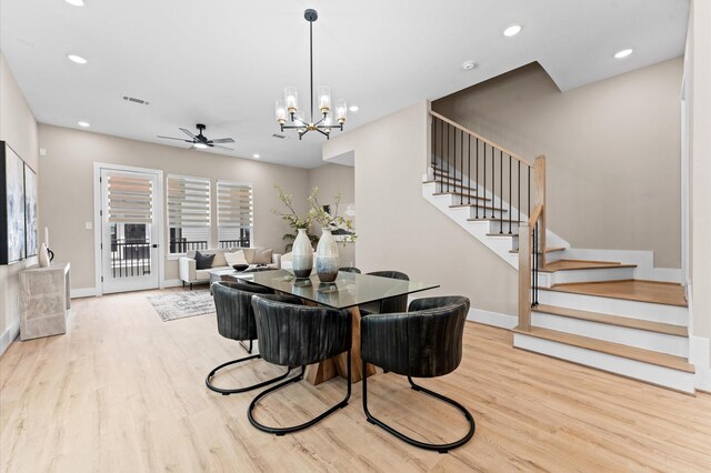 4013 Griggs Rd Unit L, Houston, TX 77021 - dining space with baseboards, ceiling fan with notable chandelier, stairs, and wood finished floors