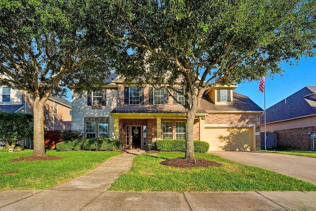 view of front of property featuring a garage, concrete driveway, a front yard, and fence