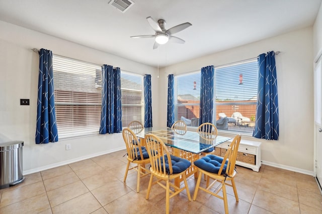 dining area with light tile patterned flooring and ceiling fan