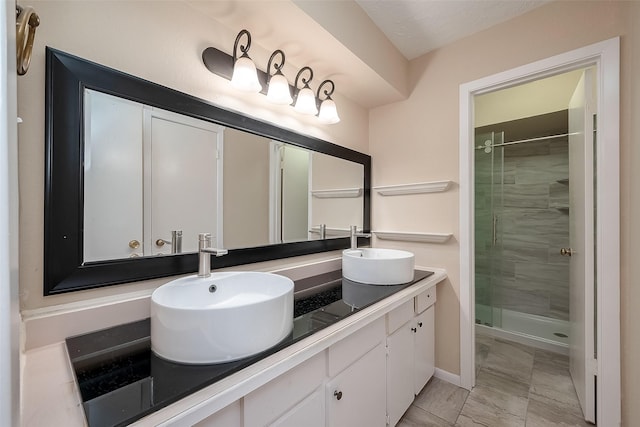 bathroom featuring vanity and an enclosed shower