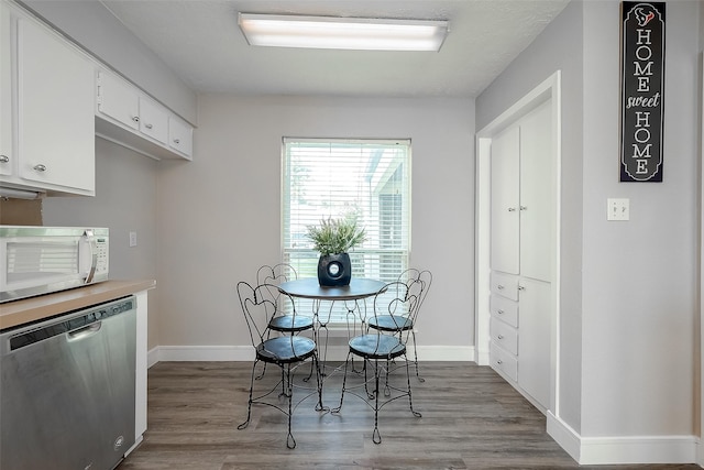 dining area featuring light wood-type flooring