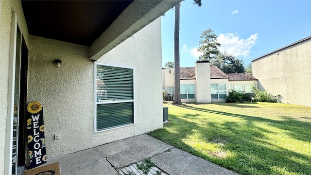 view of yard with central AC