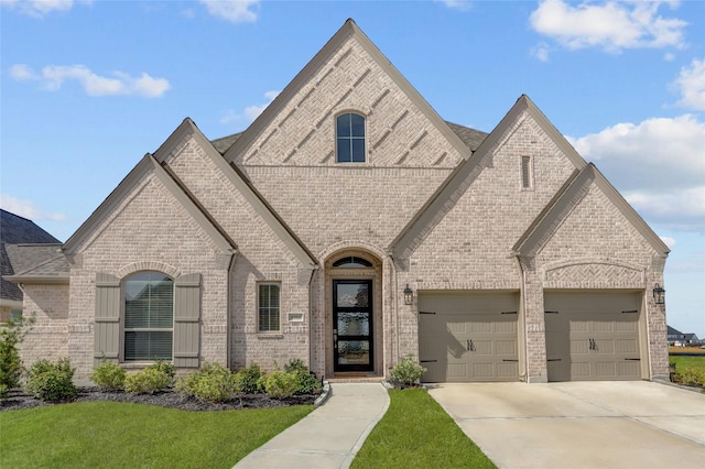 french country inspired facade with a garage and a front lawn