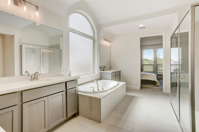 bathroom featuring tile patterned flooring, vanity, and plus walk in shower